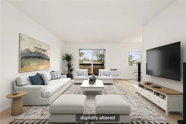 a living room with furniture a flat screen tv and a floor to ceiling window