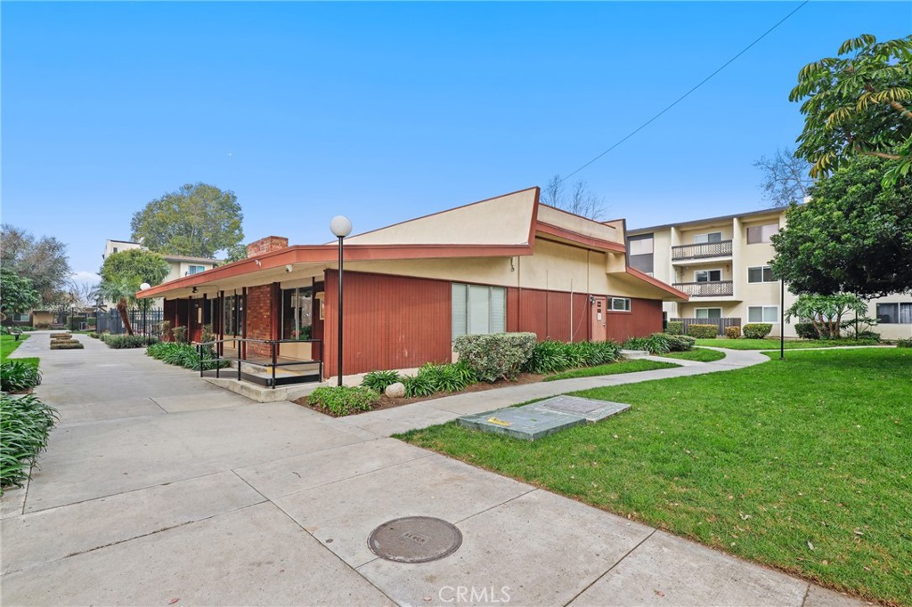 12200 Montecito Road, Unit D301 Seal Beach, CA 90740 - Photo 23 of 32 a view of a house with a yard