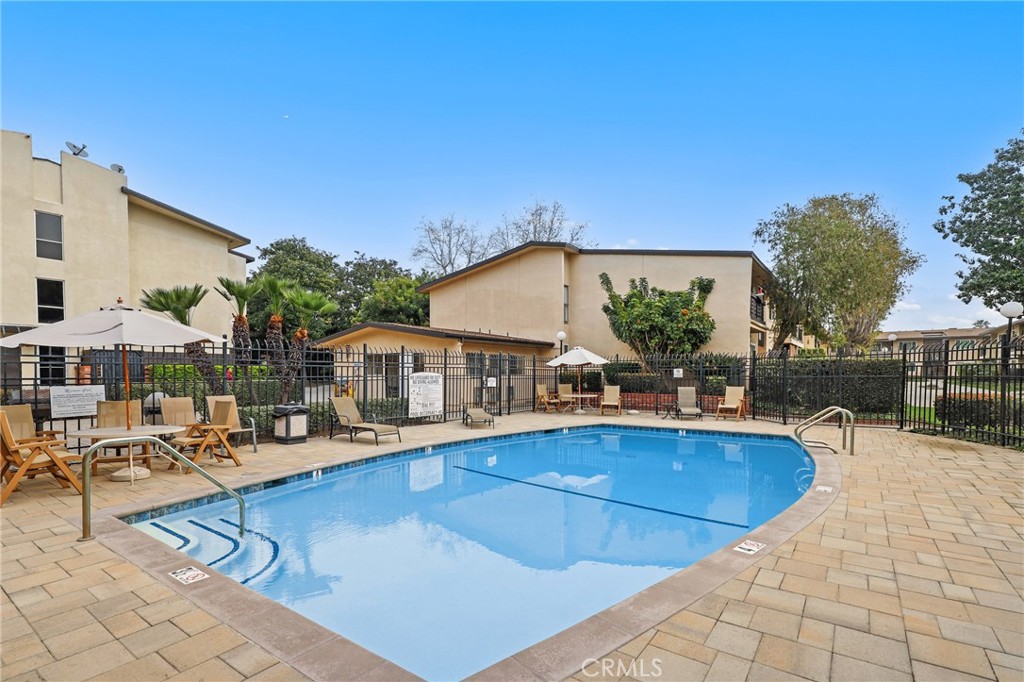 12200 Montecito Road, Unit D301 Seal Beach, CA 90740 - Photo 26 of 32 a view of outdoor space yard swimming pool and patio
