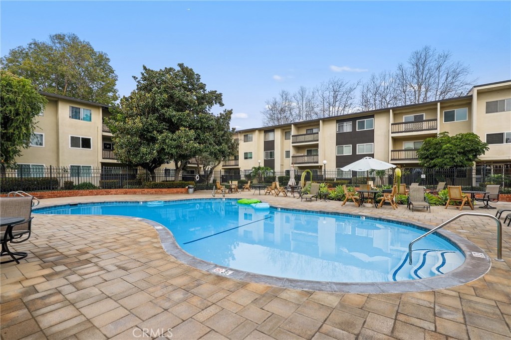 12200 Montecito Road, Unit D301 Seal Beach, CA 90740 - Photo 27 of 32 a view of swimming pool with outdoor seating