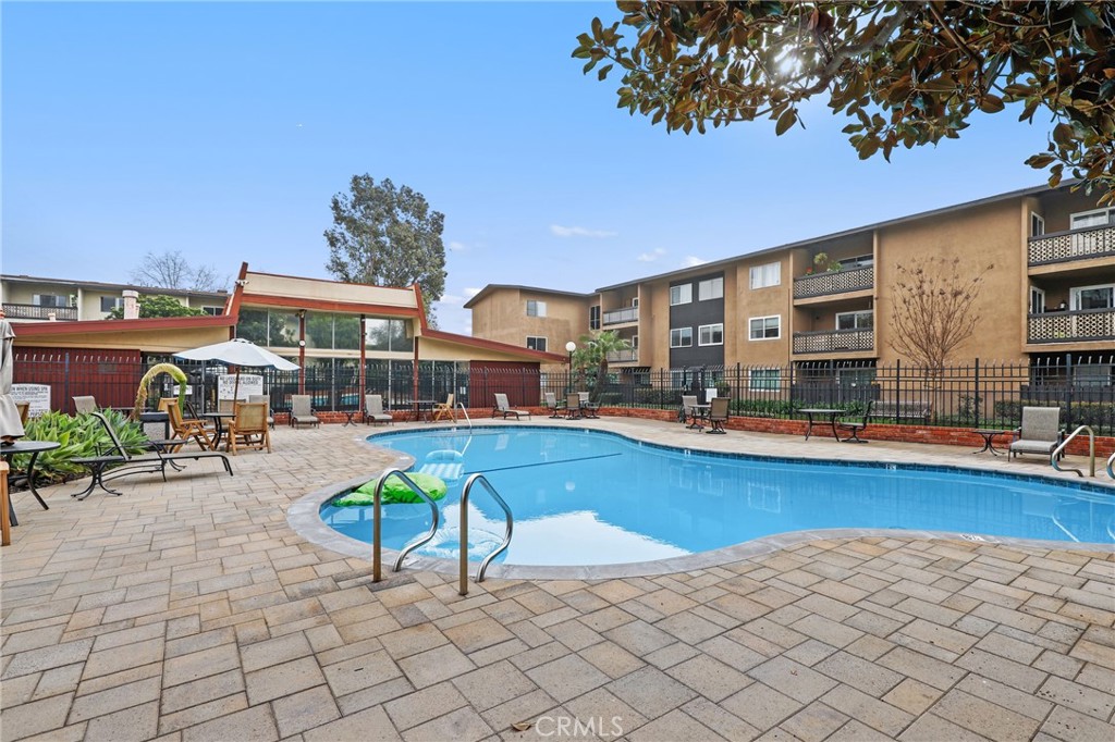 12200 Montecito Road, Unit D301 Seal Beach, CA 90740 - Photo 29 of 32 a view of a swimming pool with chairs
