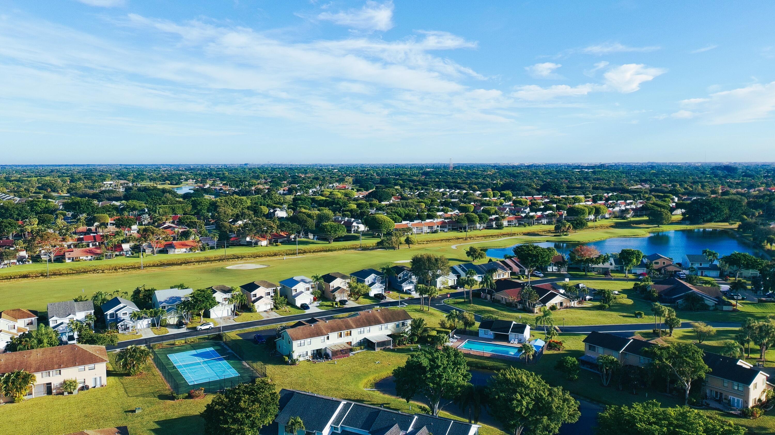 5885 Northpointe Lane Boynton Beach, FL 33437 - Photo 50 of 51 Tennis Court and Pool view