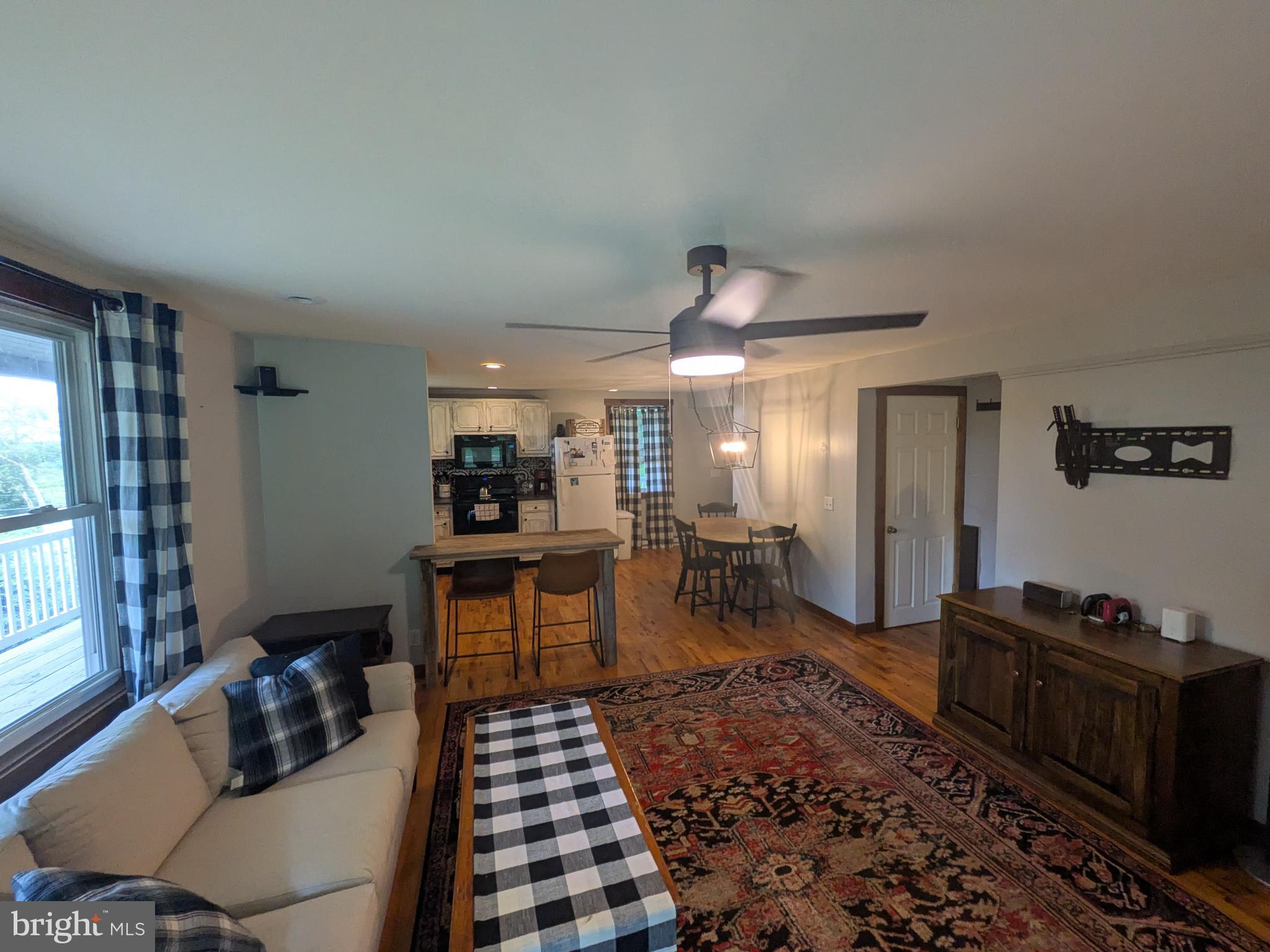 2418 Muddy Run Road Mifflintown, PA 17059 - Photo 27 of 44 a room with furniture a rug and a window