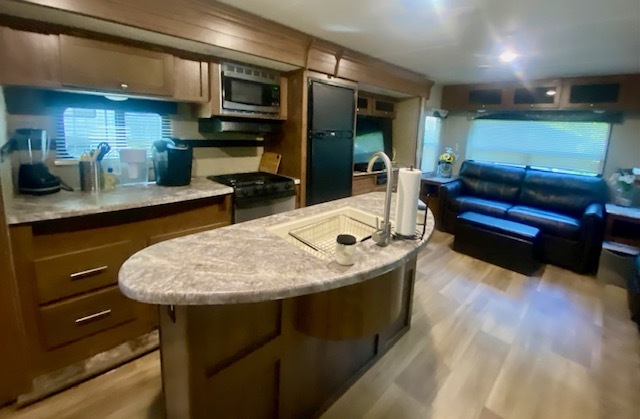 2-131 Woodhaven Sublette, IL 61367 - Photo 16 of 31 a kitchen with stainless steel appliances kitchen island granite countertop a sink and cabinets
