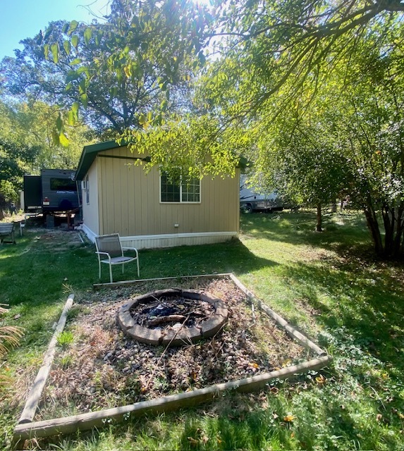 2-131 Woodhaven Sublette, IL 61367 - Photo 7 of 31 a view of a backyard with large trees