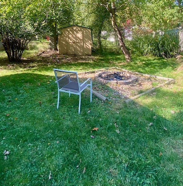 2-131 Woodhaven Sublette, IL 61367 - Photo 9 of 31 a backyard of a house with table and chairs