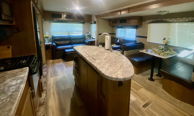 2-131 Woodhaven Sublette, IL 61367 - Photo 10 of 31 a kitchen with sink refrigerator and dining table
