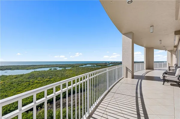 a view of balcony with couch and wooden floor