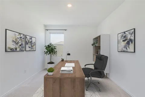 a dining room with table and cabinet