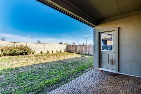 a view of a backyard of a house