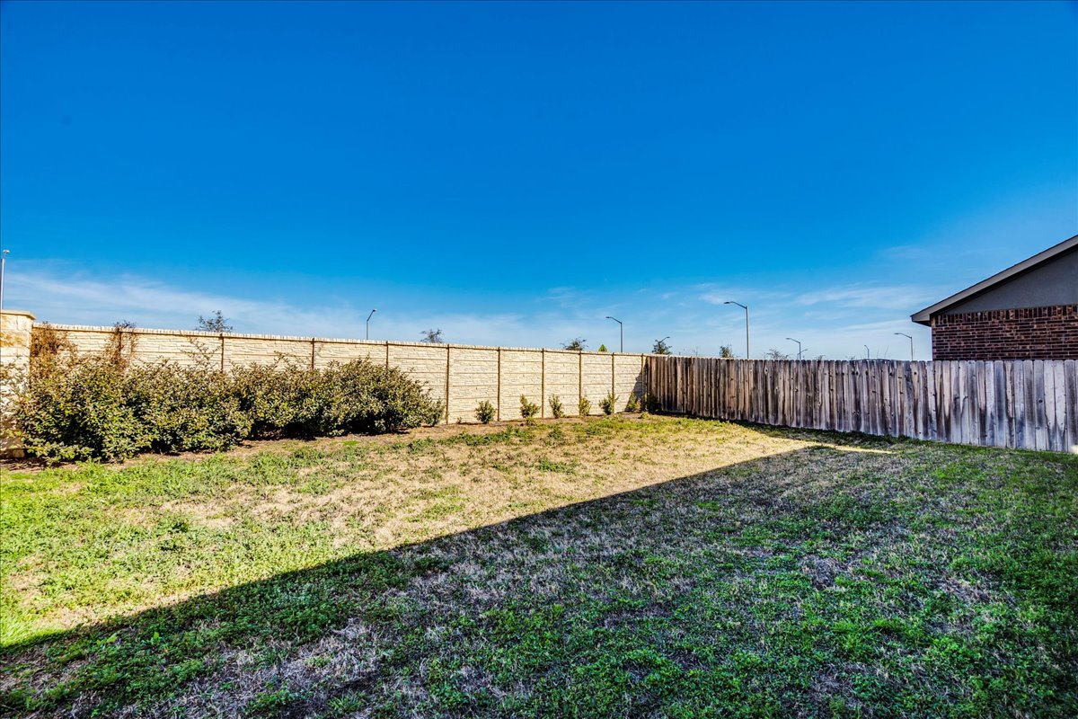1937 Guntersville Bend Leander, TX 78641 - Photo 22 of 38 a view of a backyard with wooden fence