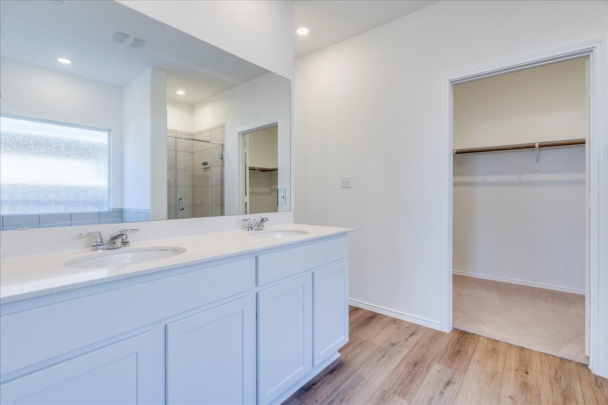 1937 Guntersville Bend Leander, TX 78641 - Photo 27 of 38 a bathroom with a sink and a mirror