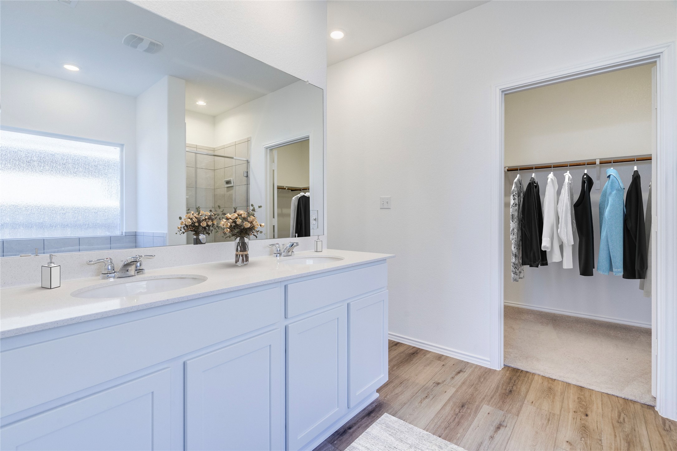 1937 Guntersville Bend Leander, TX 78641 - Photo 9 of 38 a bathroom with a double vanity sink and a mirror