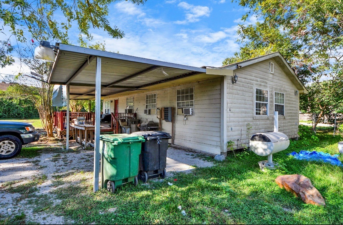 495 Genoa Red Bluff Road Houston, TX 77034 - Photo 2 of 6 a view of a chair and table in backyard of the house