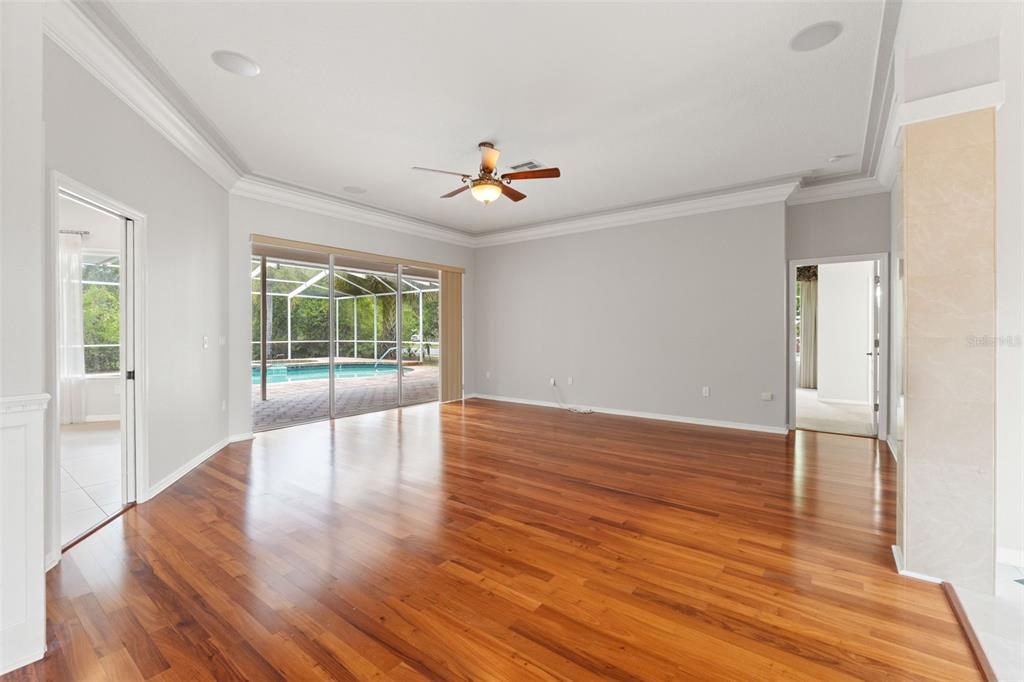 6153 New Osprey Point Weeki Wachee, FL 34607 - Photo 16 of 65 wooden floor in an empty room with a window