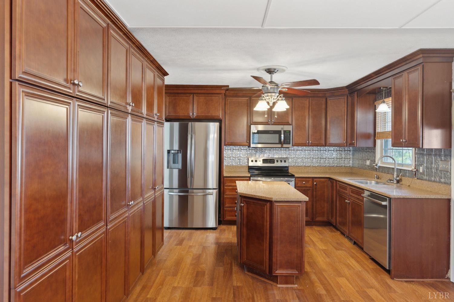 311 Bob Circle Forest, VA 24551 - Photo 11 of 61 a kitchen with stainless steel appliances granite countertop a refrigerator a sink dishwasher a stove and a refrigerator