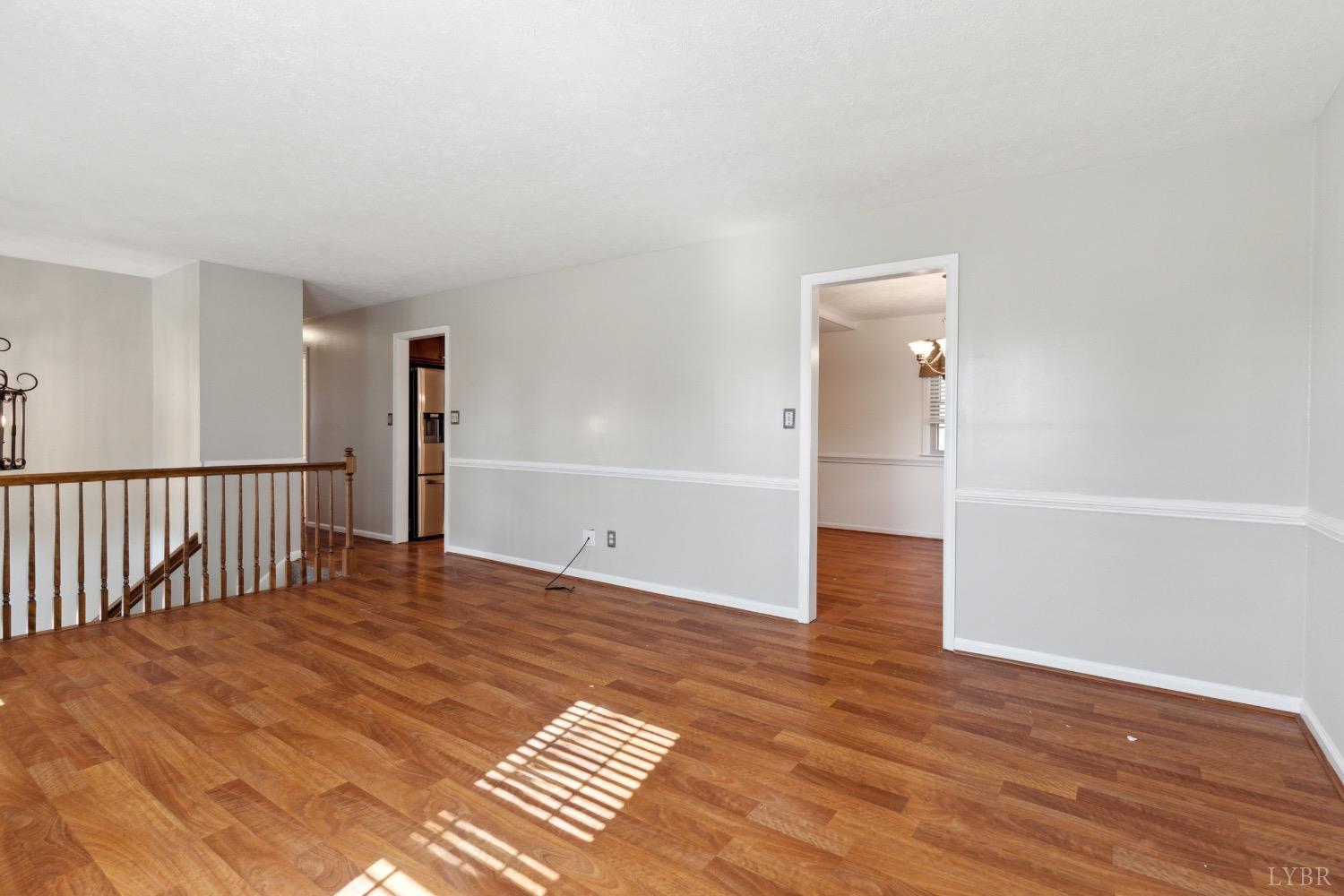 311 Bob Circle Forest, VA 24551 - Photo 15 of 61 a view of an empty room with wooden floor and a window