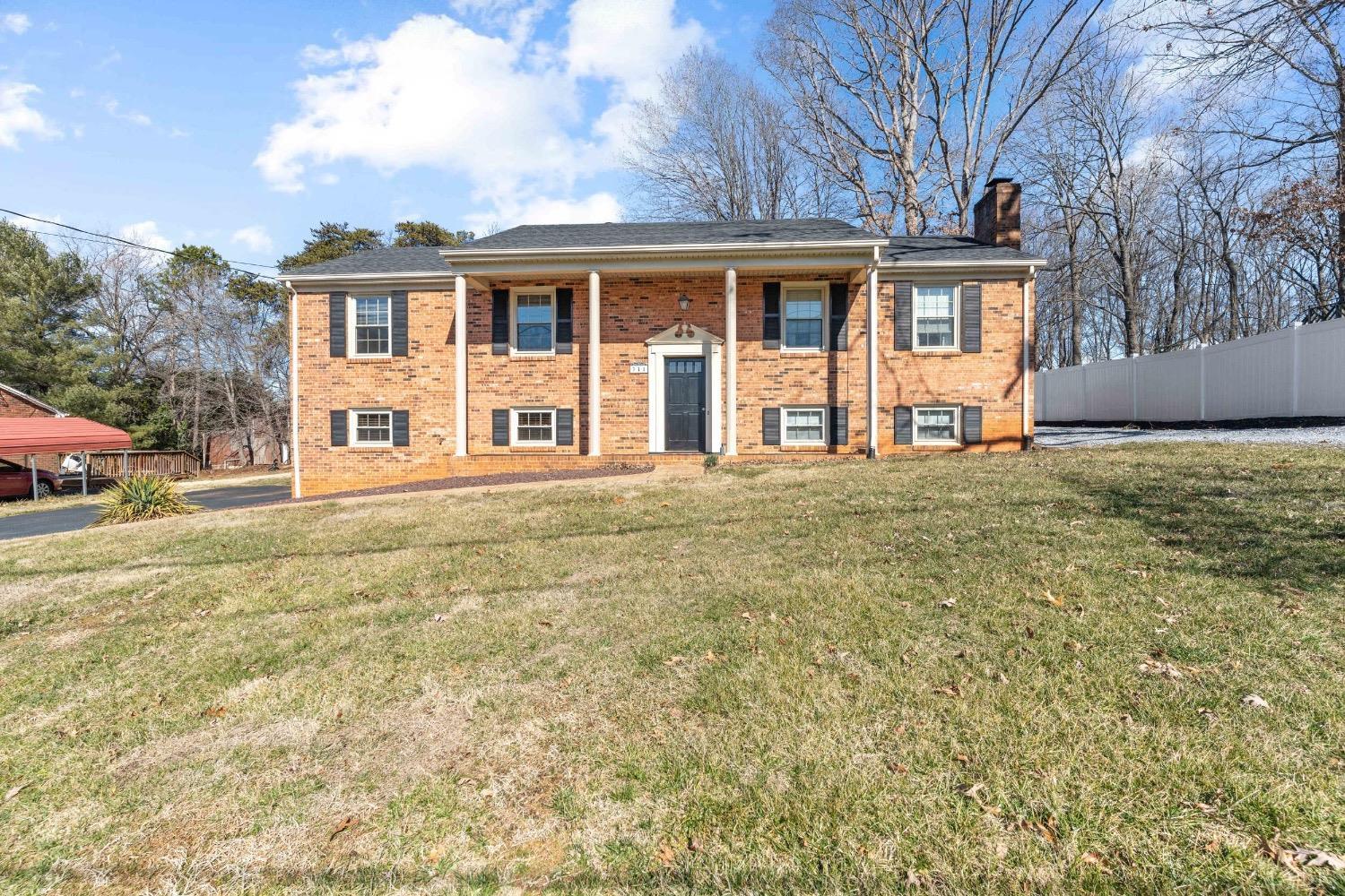 311 Bob Circle Forest, VA 24551 - Photo 2 of 61 a front view of a house with a garden