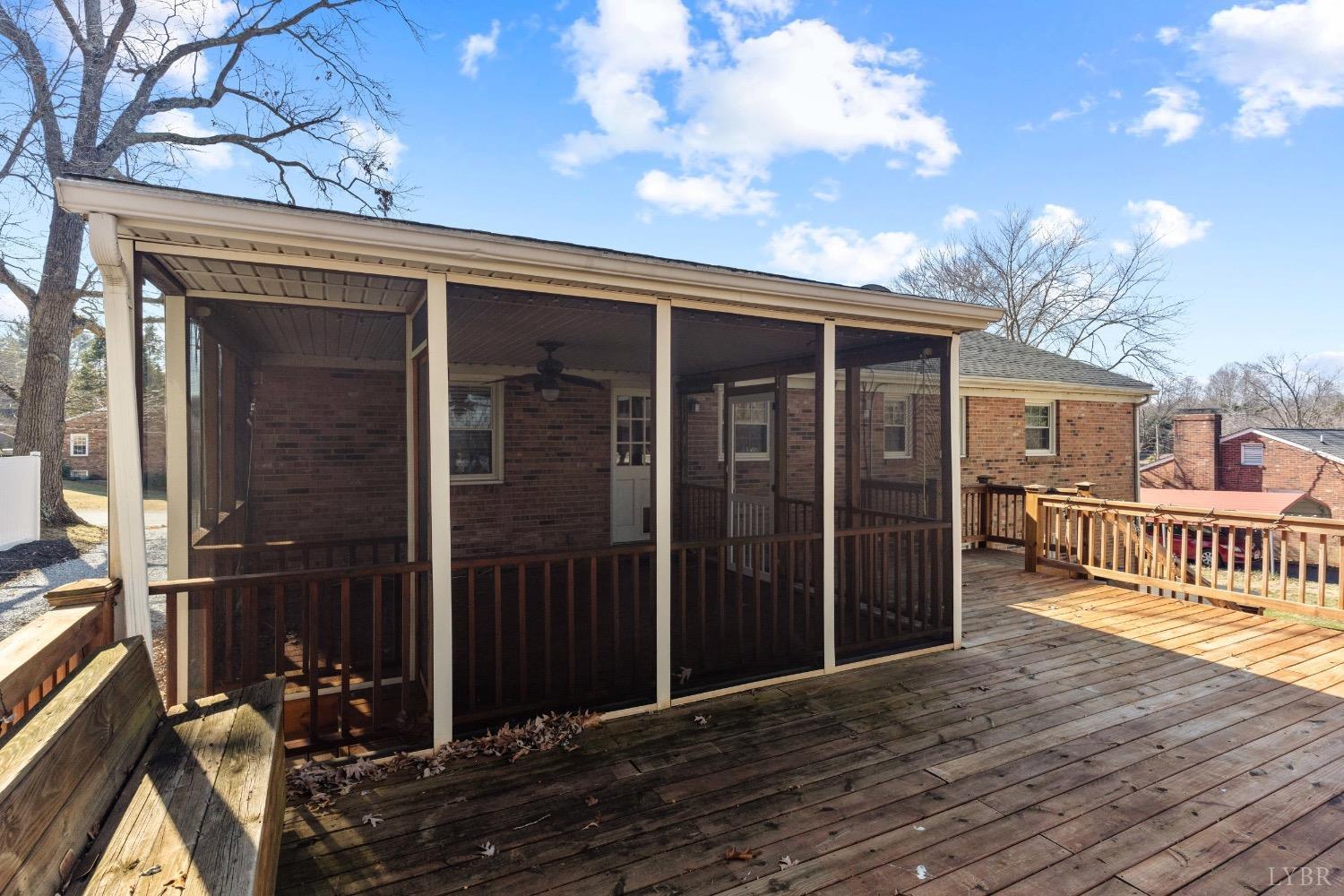 311 Bob Circle Forest, VA 24551 - Photo 23 of 61 a view of backyard with deck and wooden floor