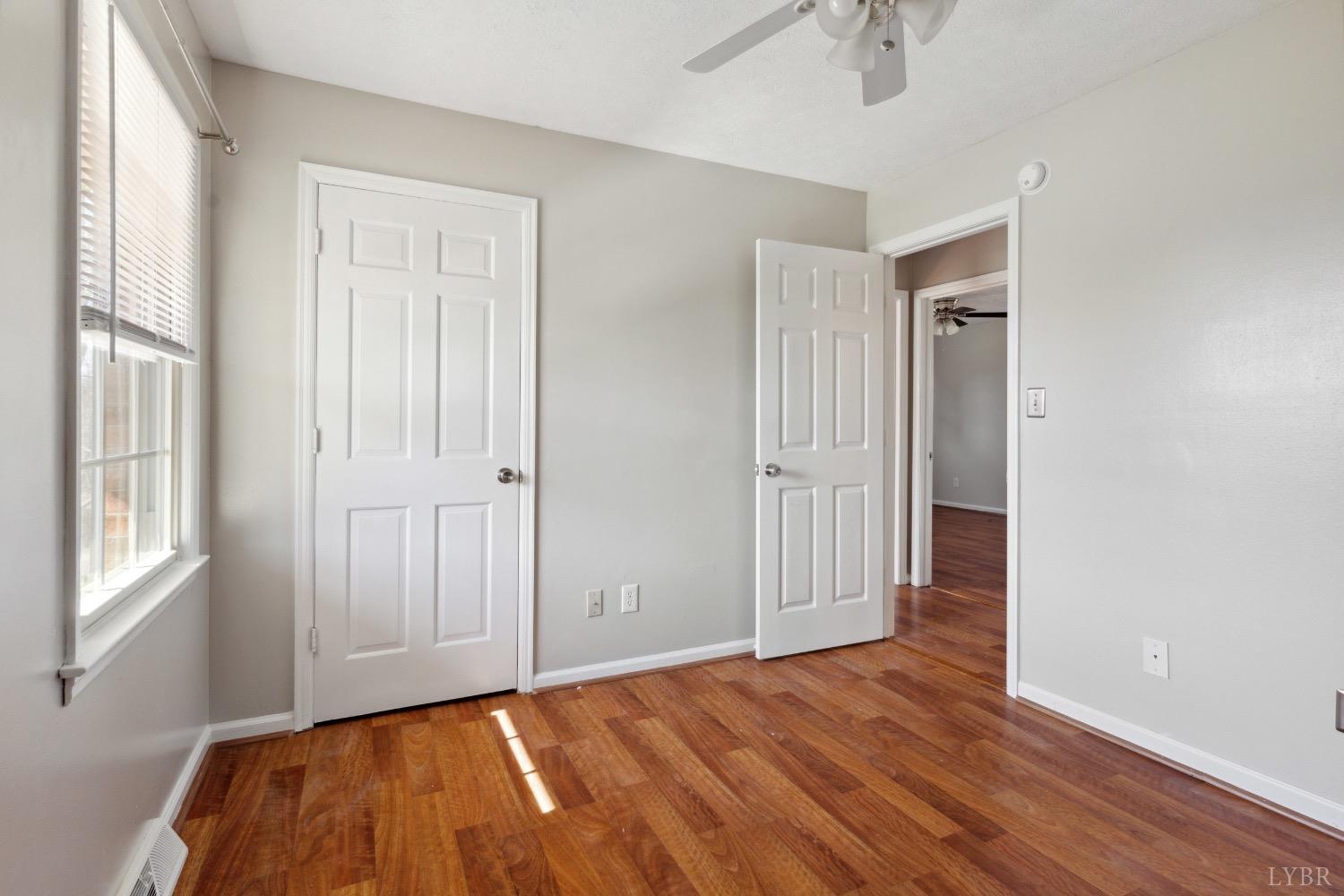 311 Bob Circle Forest, VA 24551 - Photo 26 of 61 an empty room with wooden floor and windows