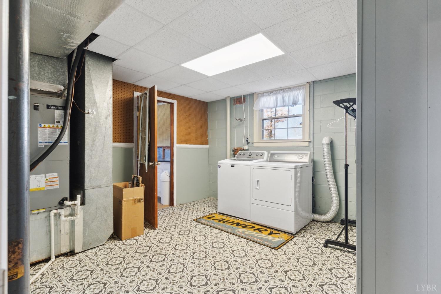 311 Bob Circle Forest, VA 24551 - Photo 48 of 61 a bathroom with a sink a toilet and a mirror