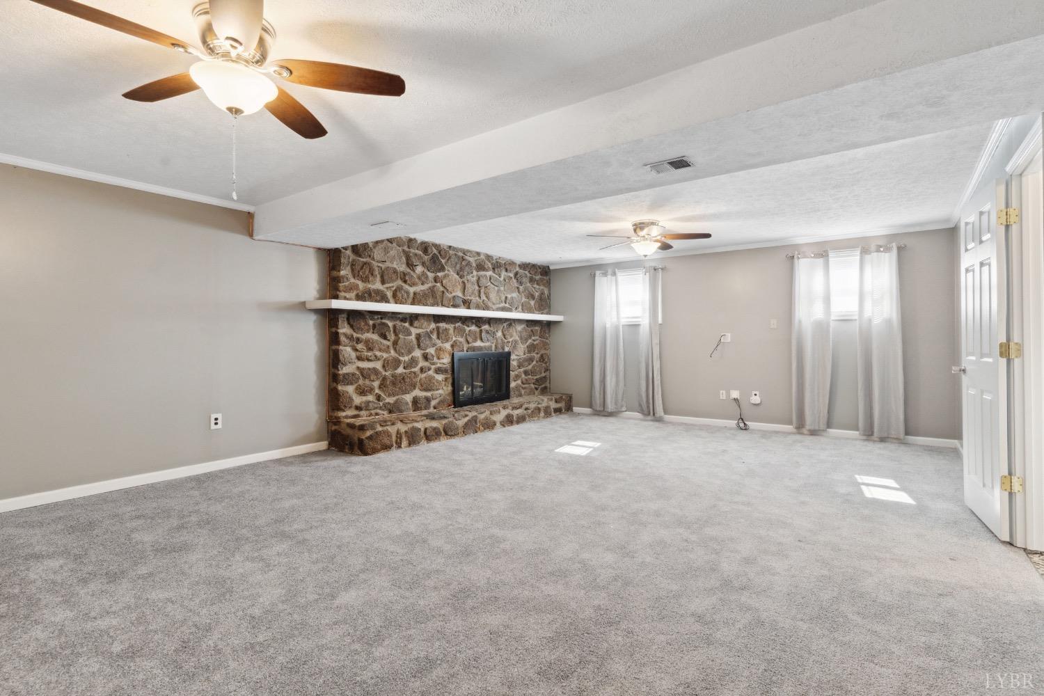 311 Bob Circle Forest, VA 24551 - Photo 57 of 61 en empty room with windows and ceiling fan
