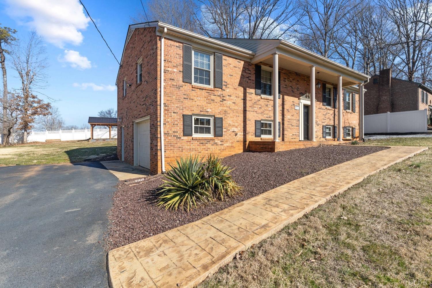 311 Bob Circle Forest, VA 24551 - Photo 8 of 61 a front view of a house with a yard and potted plants
