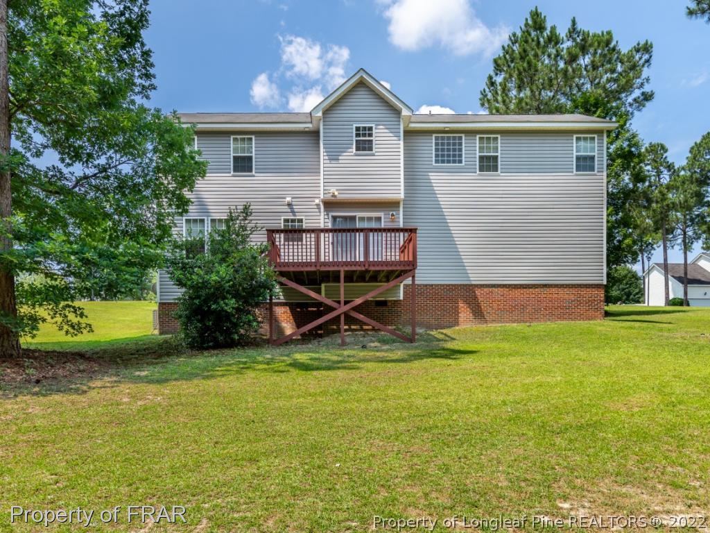 1175 Roundabout Road Cameron, NC 28326 - Photo 32 of 36 a view of a house with backyard and sitting area