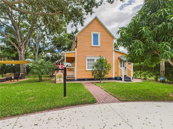 a front view of a house with a porch