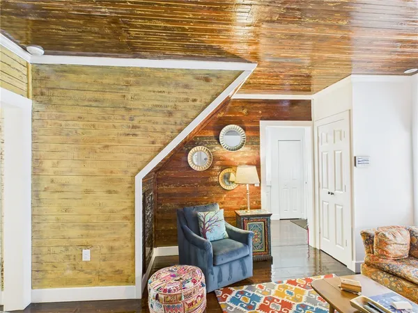 a view of hall way with furniture