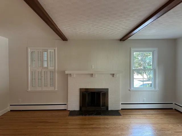 a bathroom with double sink and a mirror