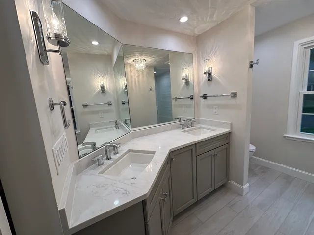 a bathroom with a toilet and a vanity
