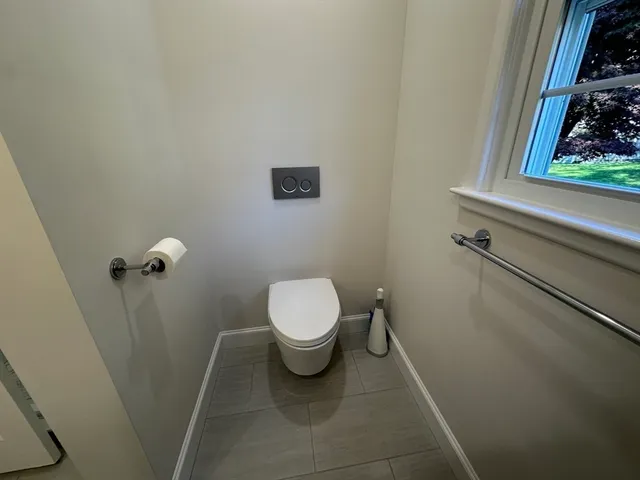 a view of staircase with white walls