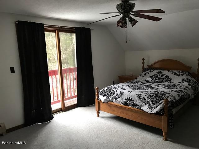 389 Sandmill Road Cheshire, MA 01225 - Photo 17 of 33 a bed sitting in a bedroom next to a window