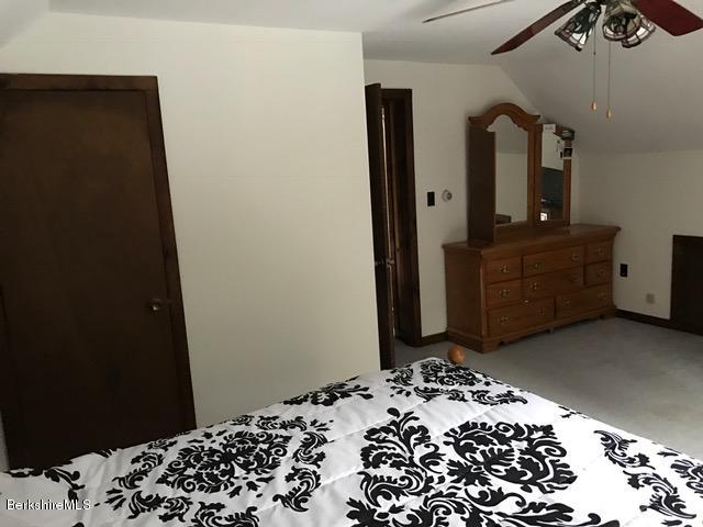 389 Sandmill Road Cheshire, MA 01225 - Photo 18 of 33 a bedroom with a bed and dresser