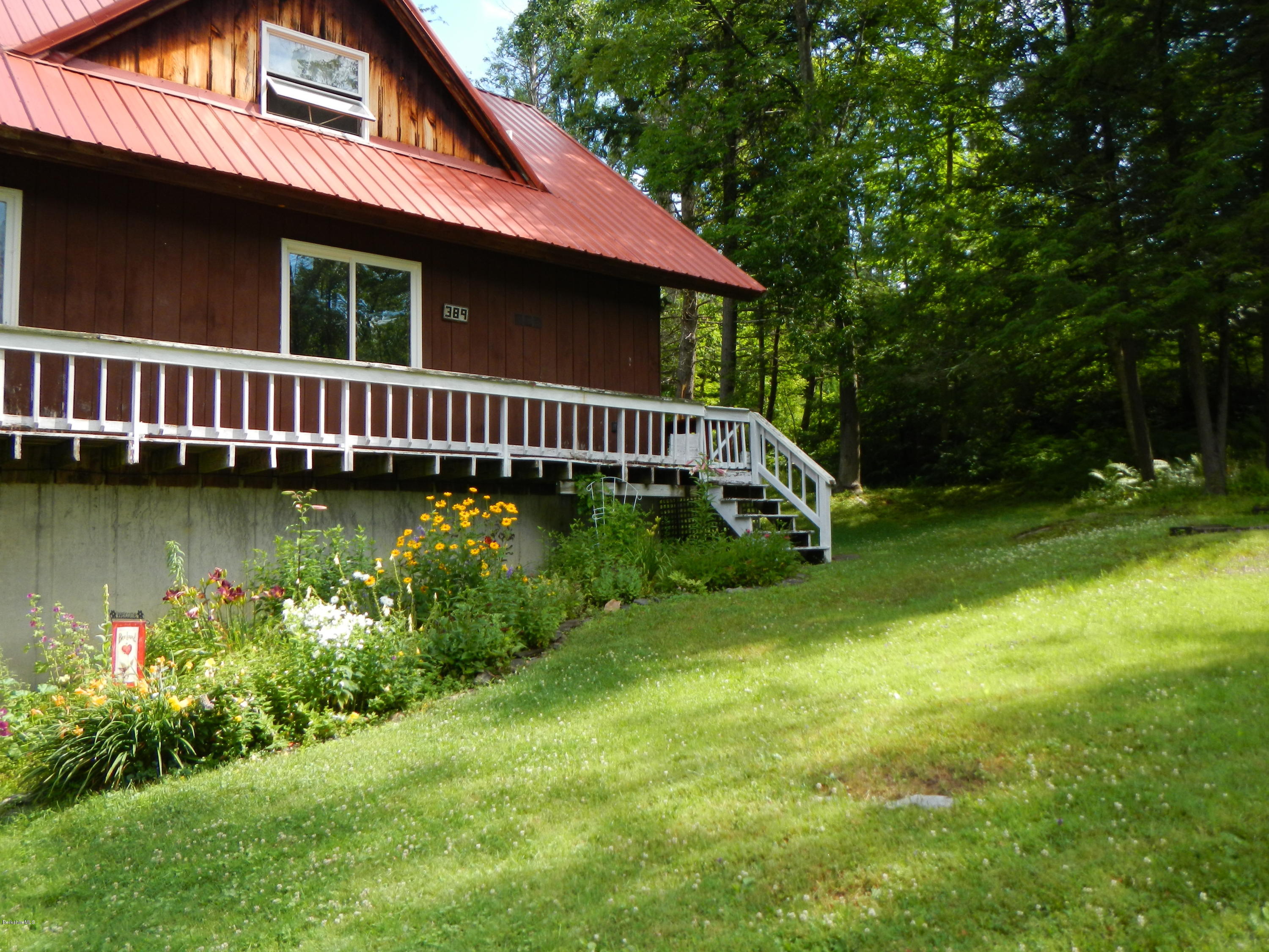 389 Sandmill Road Cheshire, MA 01225 - Photo 21 of 33 a view of a house with a yard