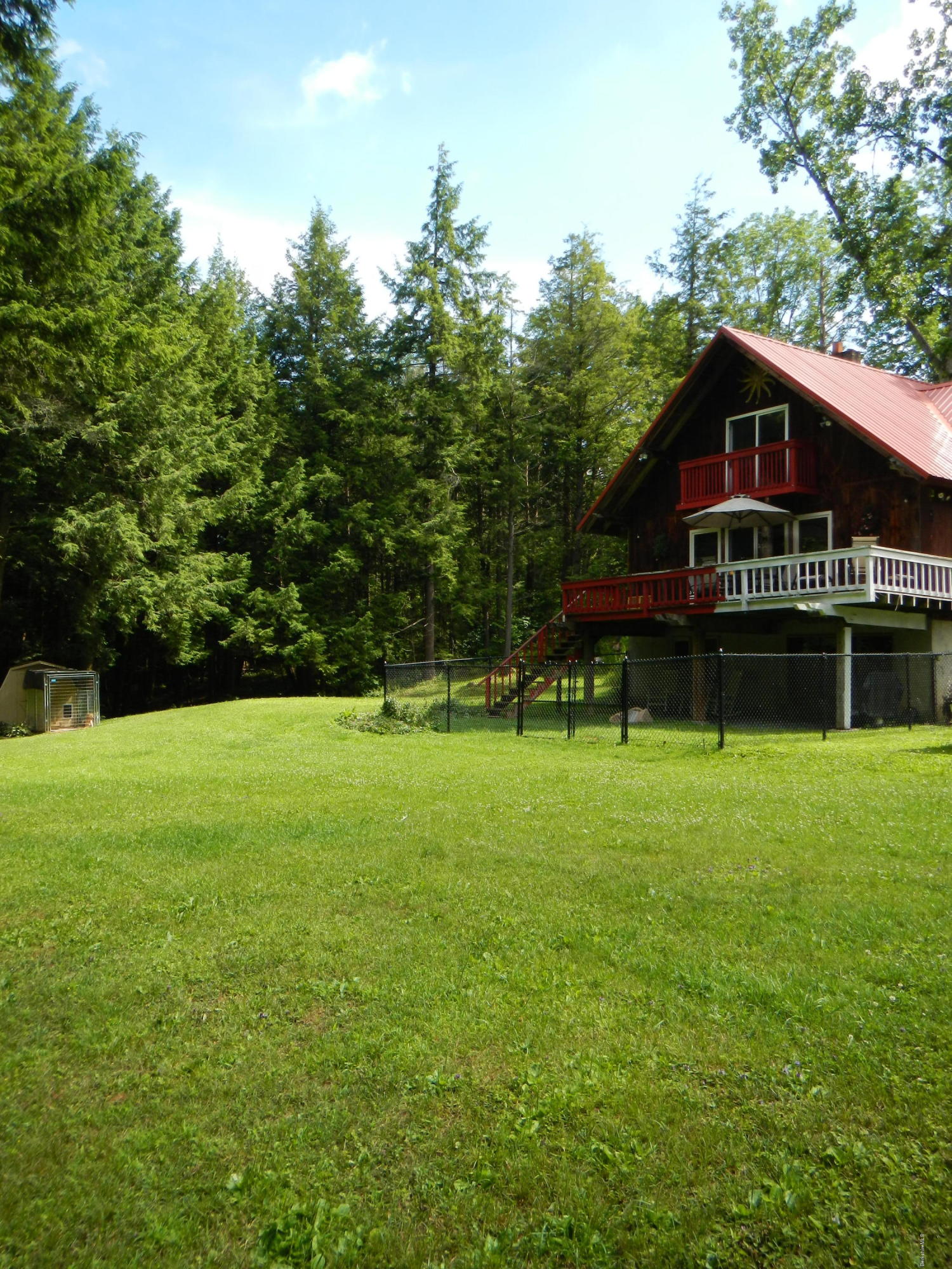 389 Sandmill Road Cheshire, MA 01225 - Photo 30 of 33 a view of a house with a yard