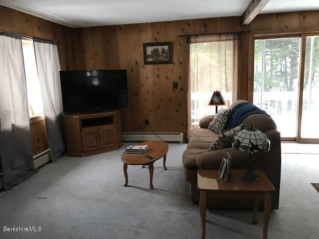 389 Sandmill Road Cheshire, MA 01225 - Photo 7 of 33 a living room with furniture and a flat screen tv