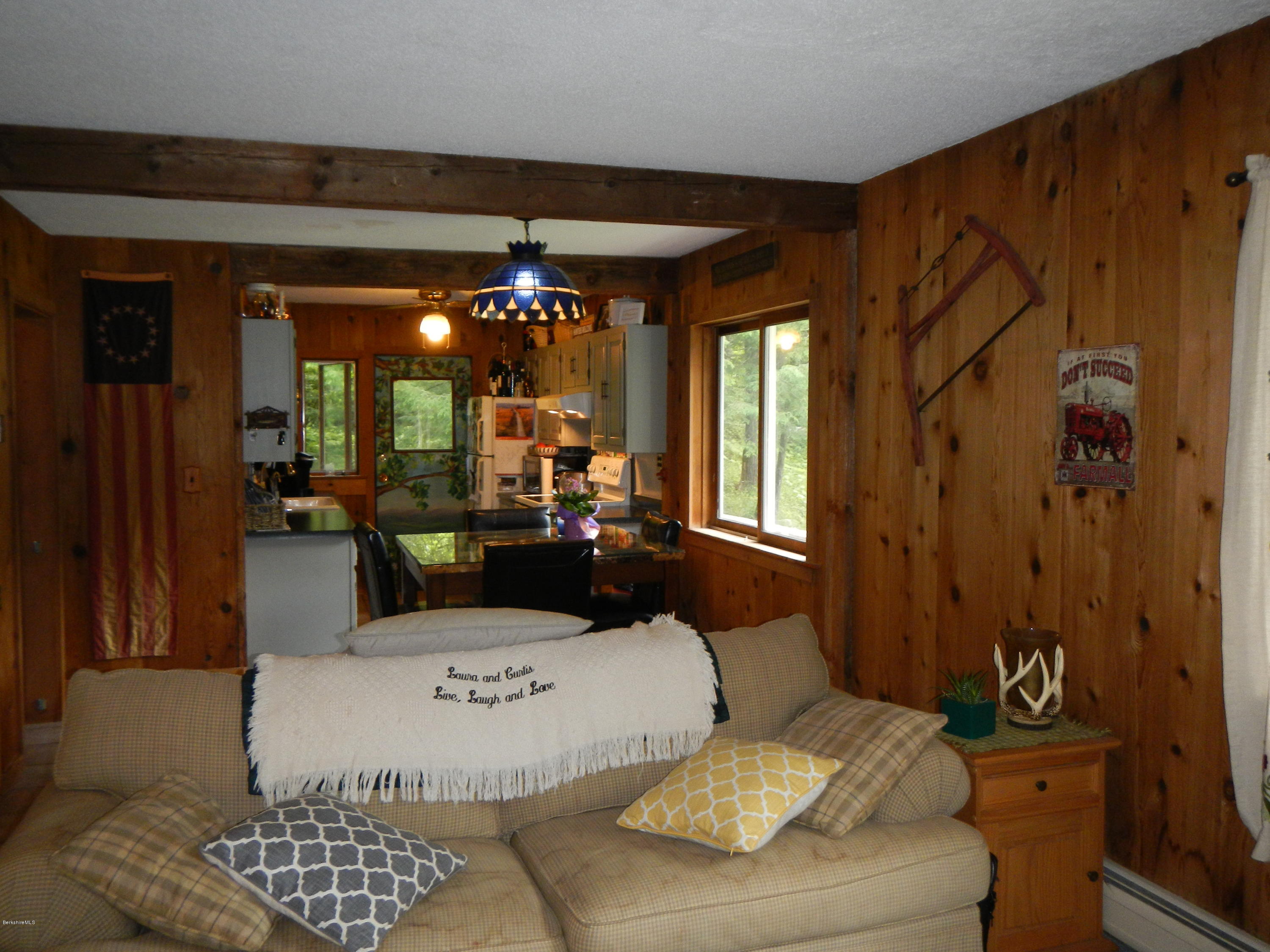 389 Sandmill Road Cheshire, MA 01225 - Photo 8 of 33 a living room with furniture and a chandelier