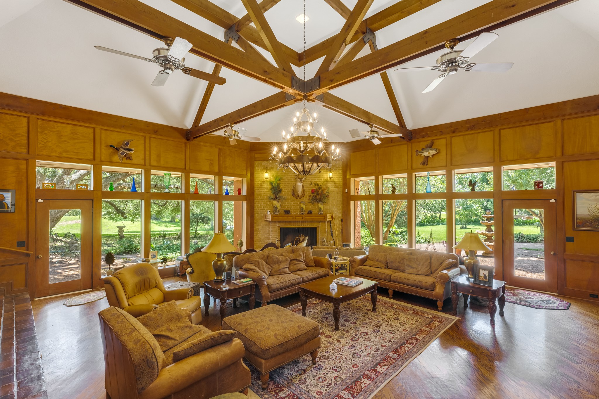 2009 FM 950 Road Eagle Lake, TX 77434 - Photo 16 of 27 a living room with furniture large windows and wooden floor