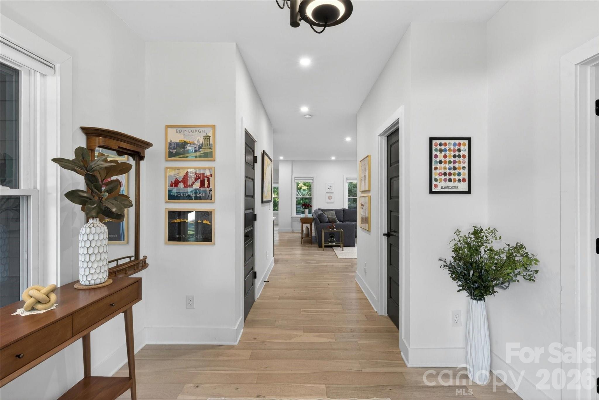 1608 Chippendale Road Charlotte, NC 28205 - Photo 10 of 46 a view of a hallway with furniture and a potted plant