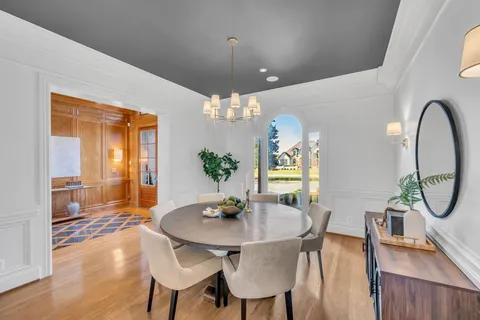 a spacious bathroom with a tub sink and mirror