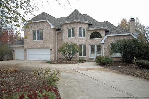 15W752 83rd Street Burr Ridge, IL 60527 - Photo 1 of 16 a front view of a house with a yard and garage