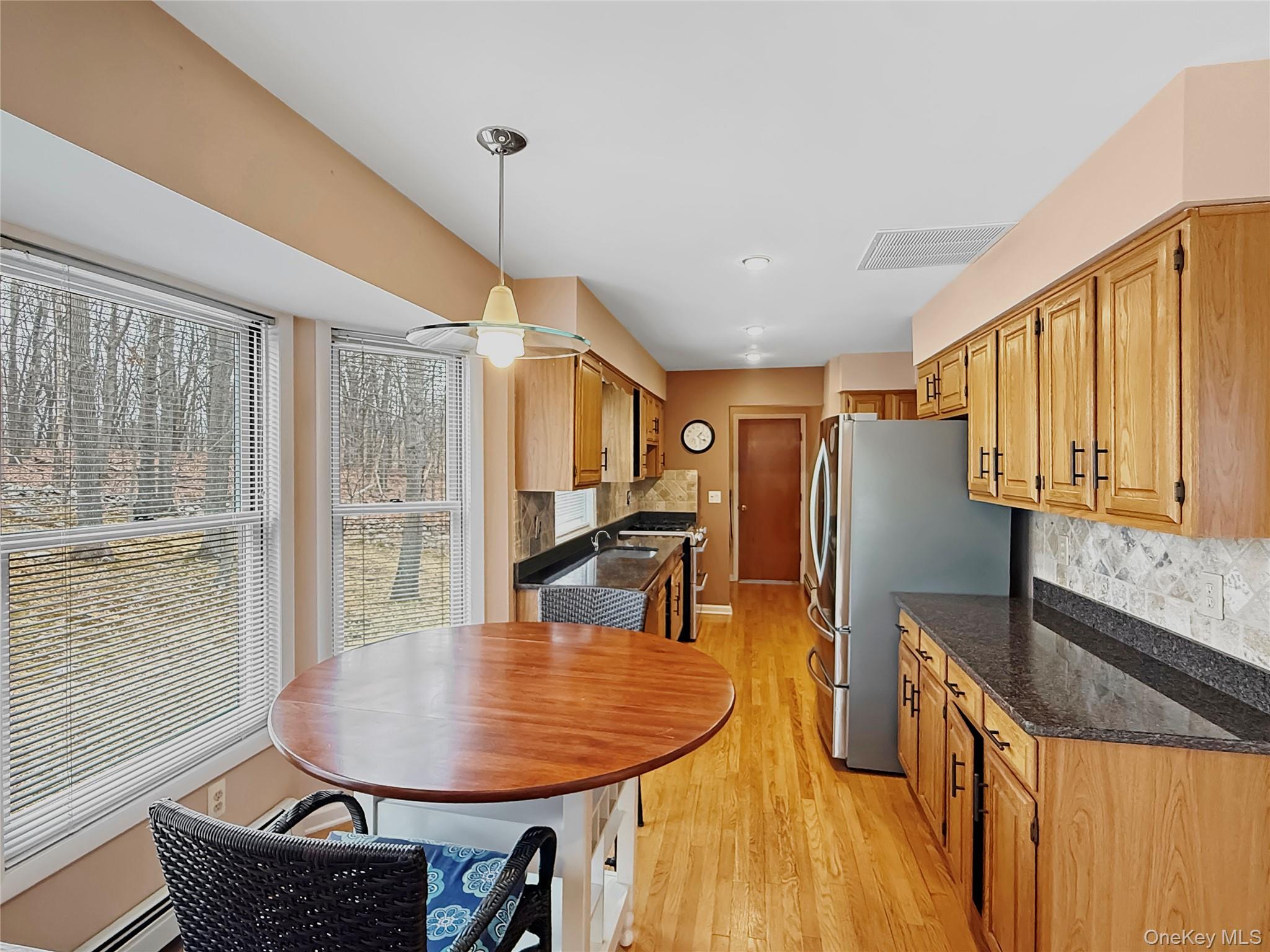 101 Travis Corners Road Garrison, NY 10524 - Photo 5 of 13 Kitchen with woodland views and access to garage