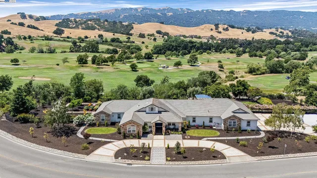 an aerial view of residential houses and outdoor space