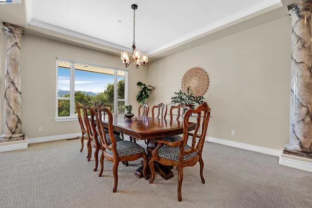 a kitchen with stainless steel appliances granite countertop a sink a stove and a wooden floors