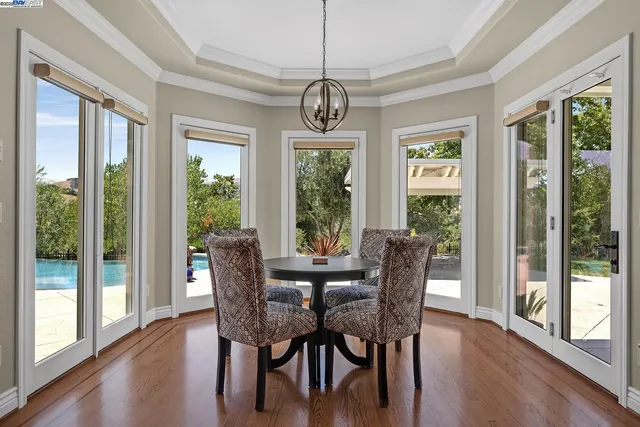 a bedroom with a bed couch and a fireplace