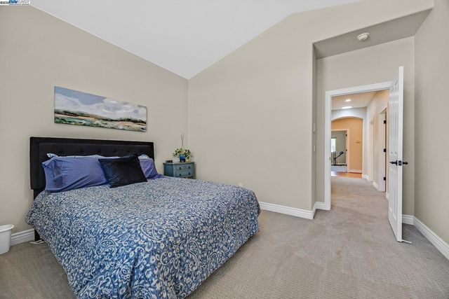 a bathroom with double sink and a mirror