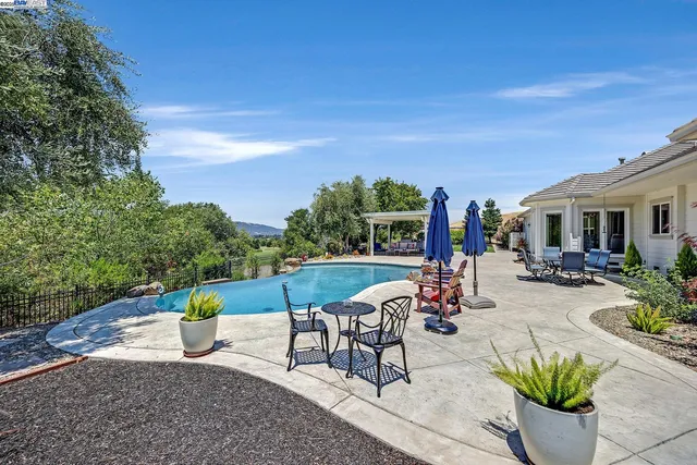 a kitchen view with a sink and garden