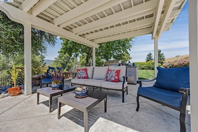 an aerial view of a house with yard swimming pool and outdoor seating